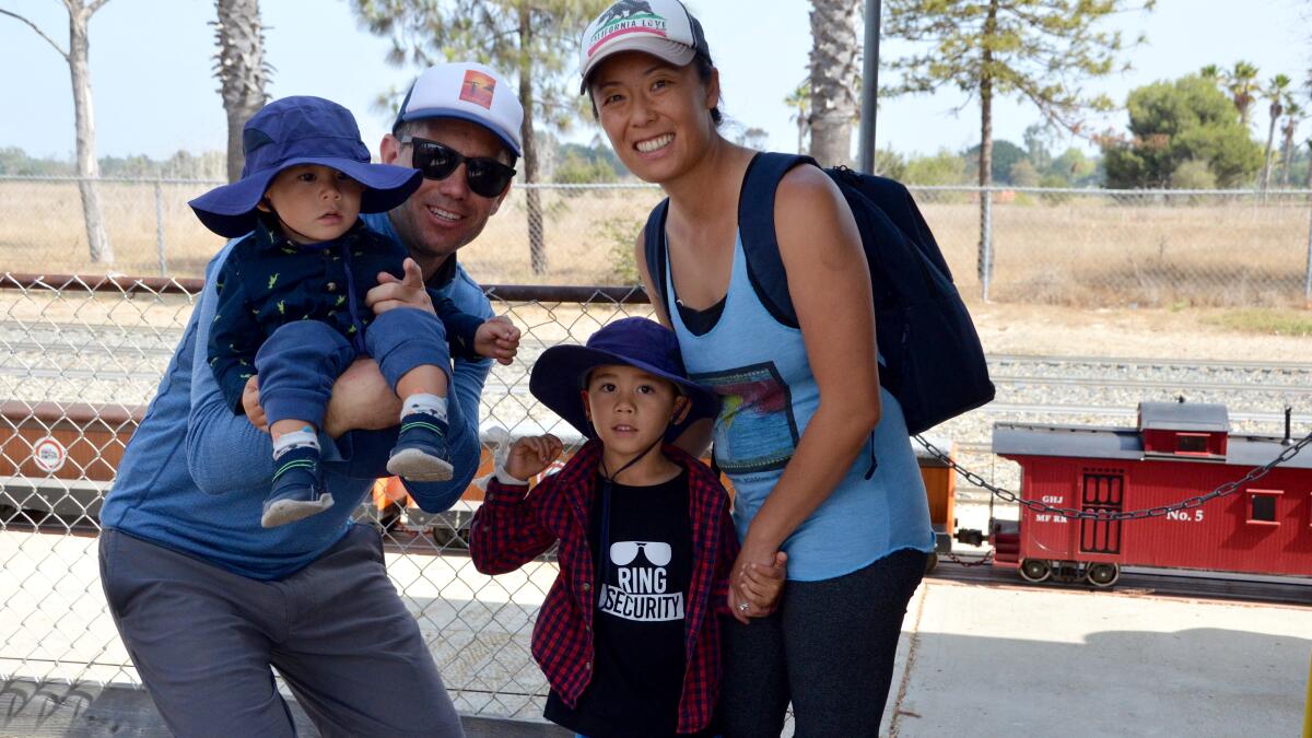 Matt Malone, Betty Chan, with kids, Koa, 2 and Kai, 5 are happy to revisit the OCME at Fairview Park.
