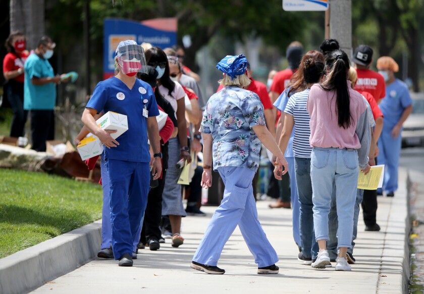 Protesters rally outside Fountain Valley Regional Hospital and Medical Center in August