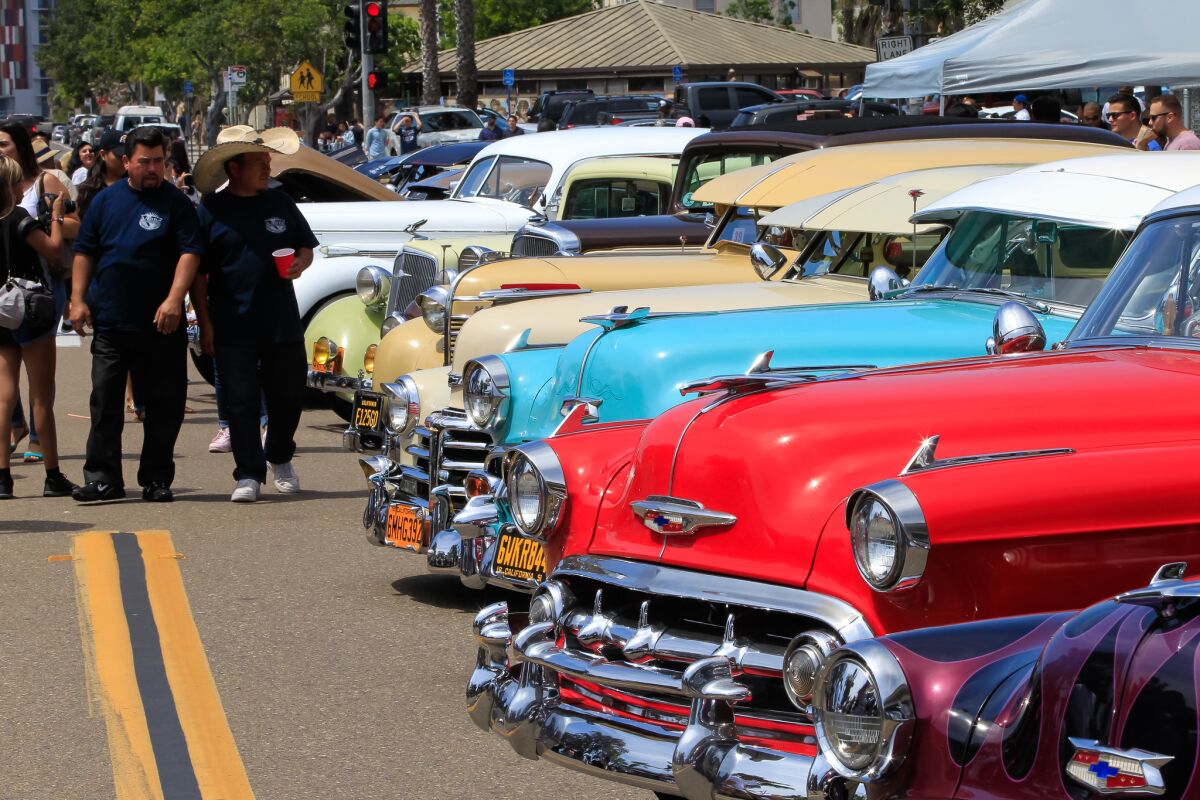 Crowds enjoy the cars at the 47th annual Chicano Park Day celebration.