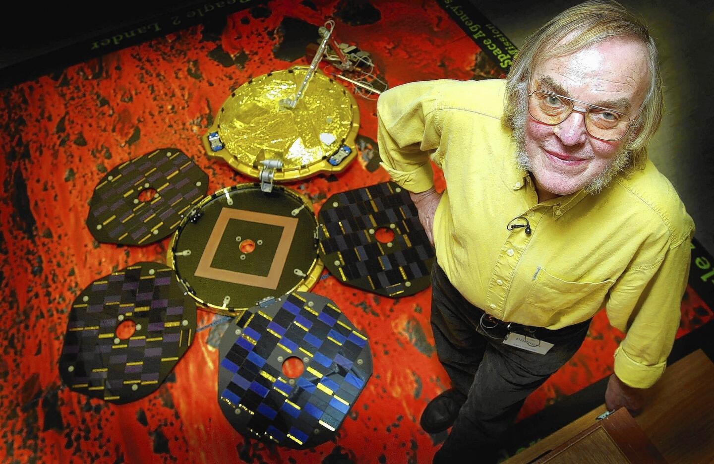 Scientist Colin Pillinger poses with a model of Beagle 2 in 2003.