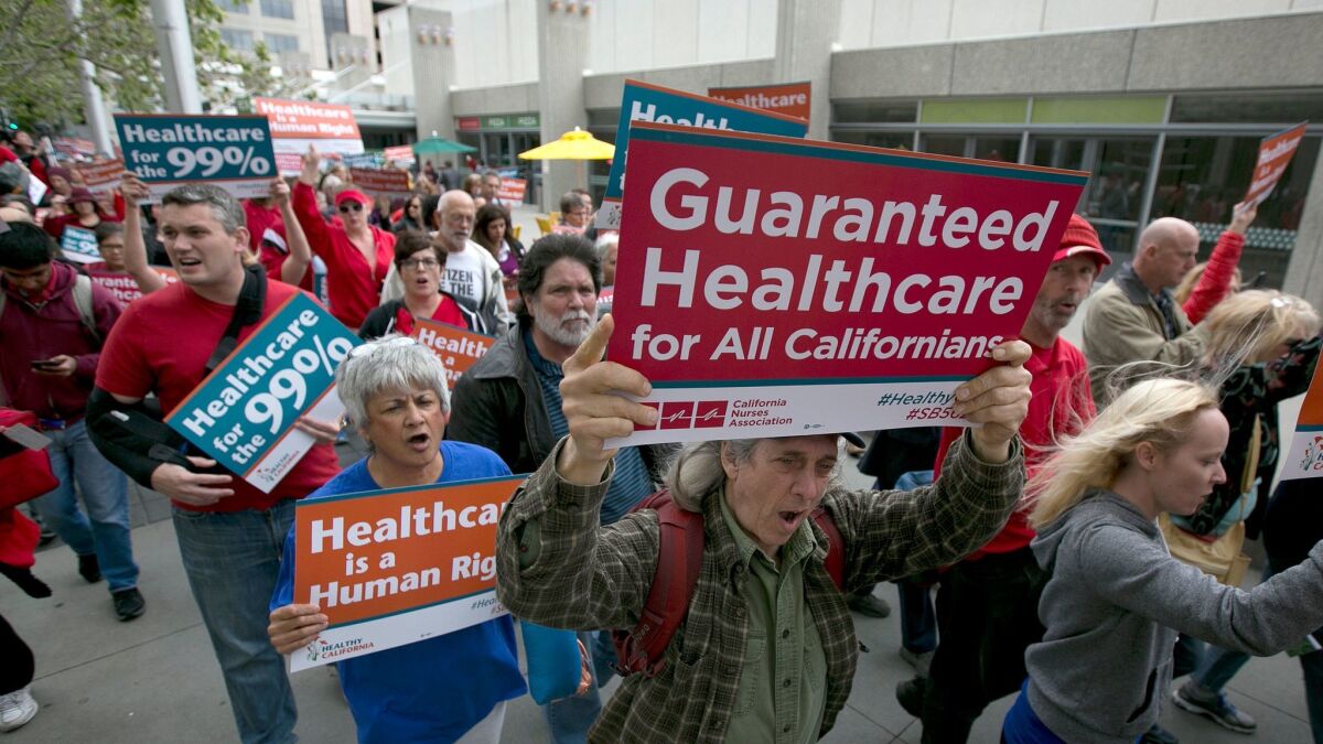 Supporters of single-payer healthcare march to the Capitol in Sacramento on April 26.