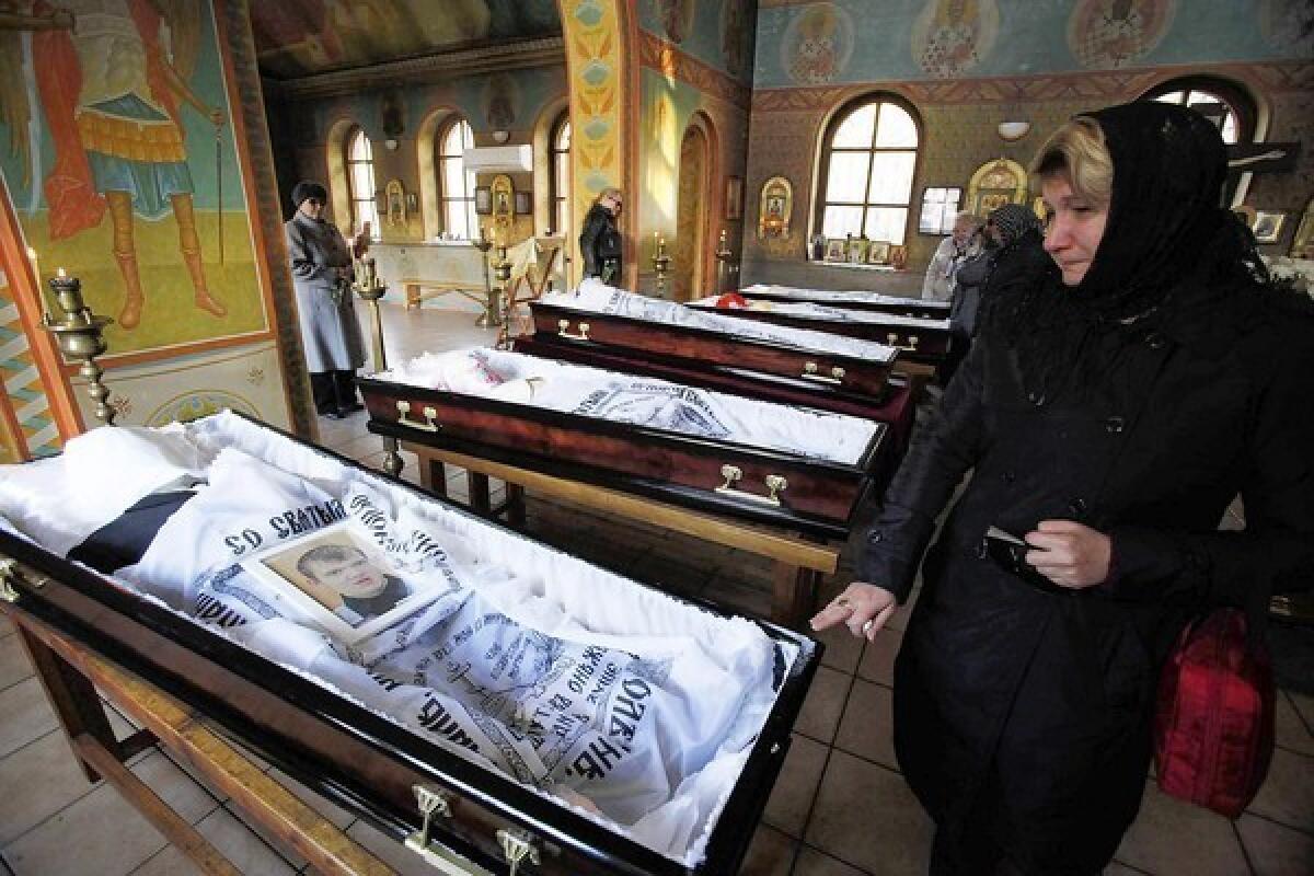 The caskets of five teenagers killed by a suspected drunk driver are displayed at an Orthodox temple in Moscow.