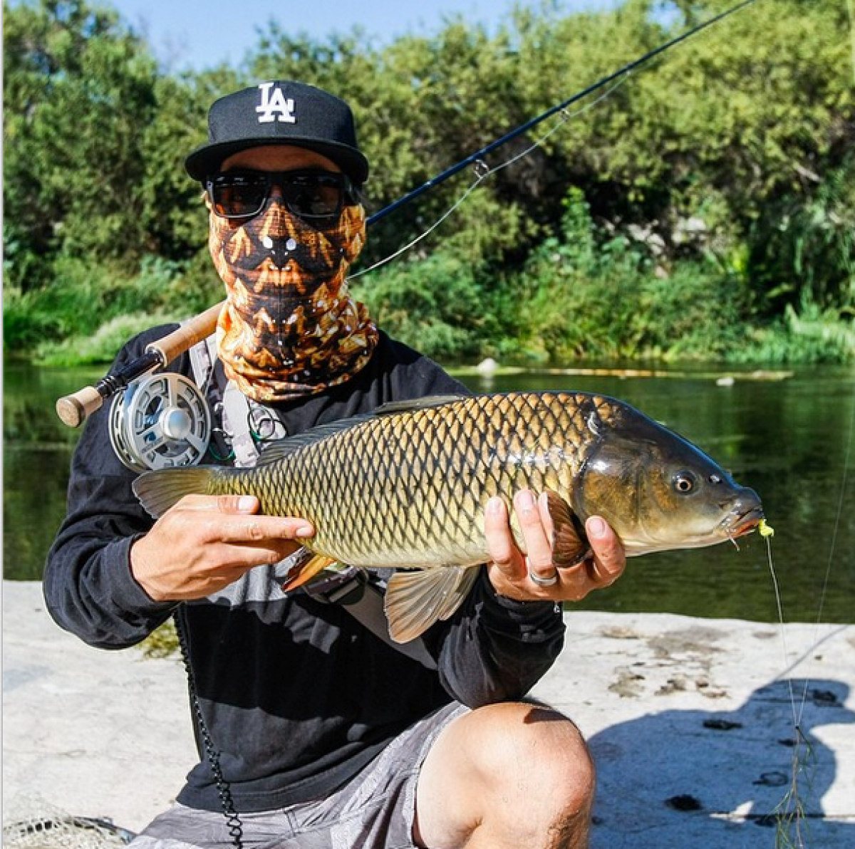 Matus Sobolic, 29, of Altadena caught a Carp during the "Off the Hook" fishing derby on the Los Angeles River.