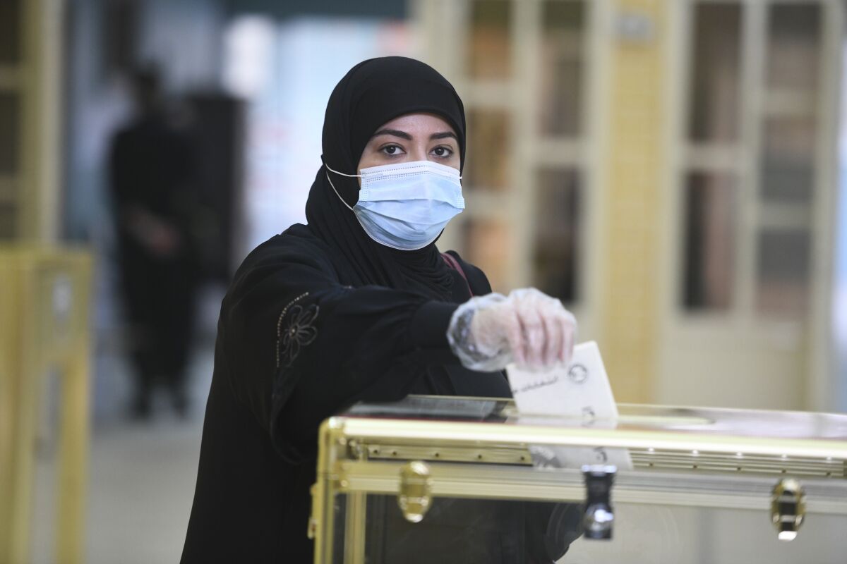 A woman casts her vote Saturday in Hawally, Kuwait.