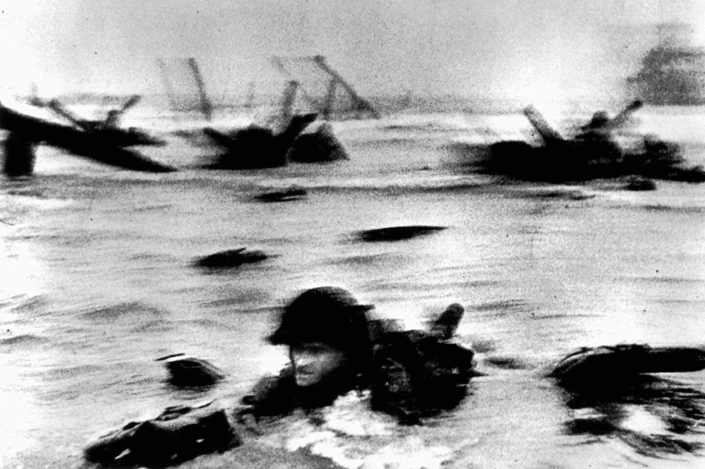 "D-Day, Omaha Beach," Robert Capa's photo of the 1944 Normandy invasion, survived darkroom mishaps to convey with its grainy look much of the urgent drama of the occasion.