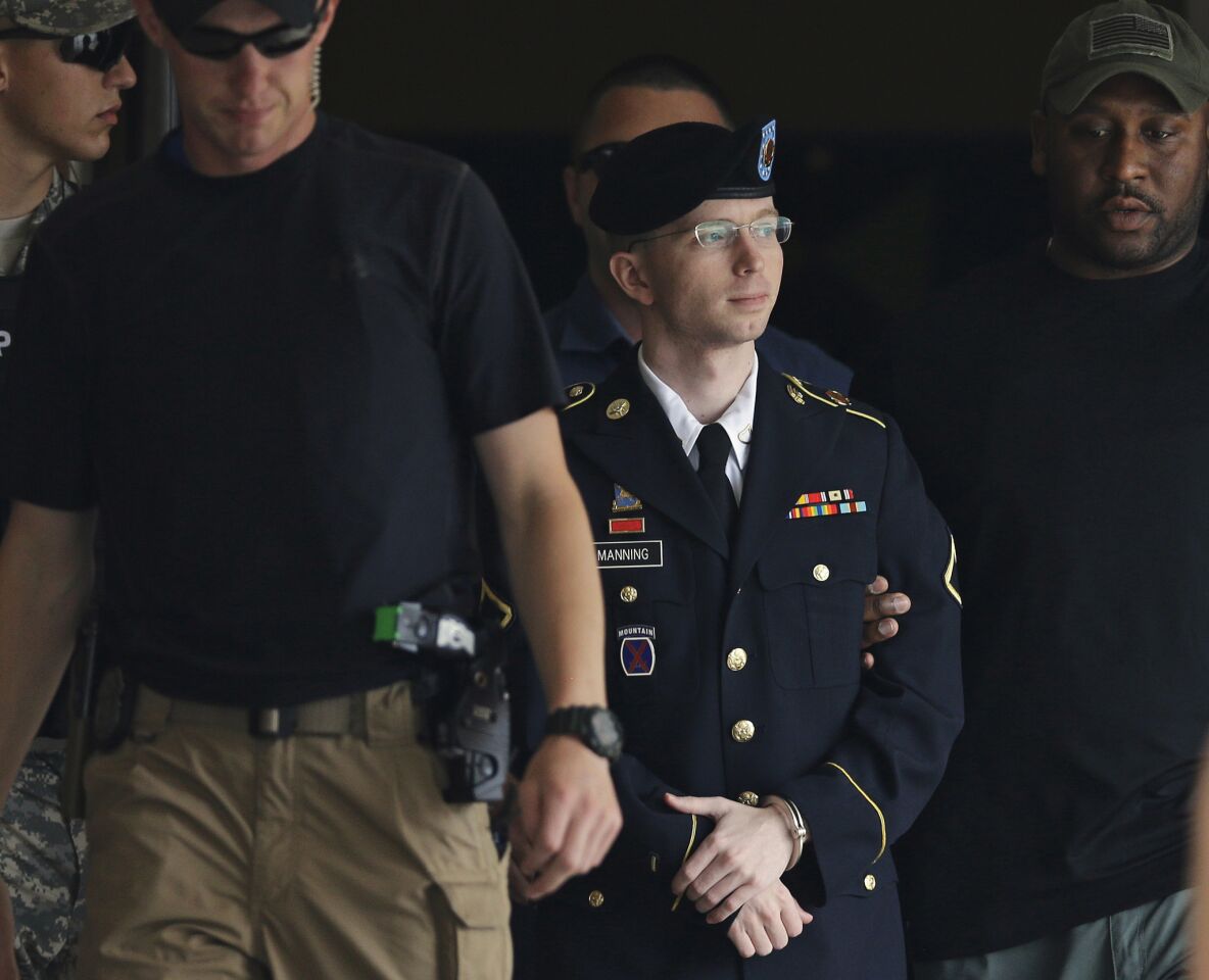 Army Pfc. Chelsea Manning (known until August as Bradley Manning) is escorted out of a courthouse in Fort Meade, Md., after receiving a verdict in his court martial. Manning was sentenced to 35 years in prison for her role in giving material to WikiLeaks.
