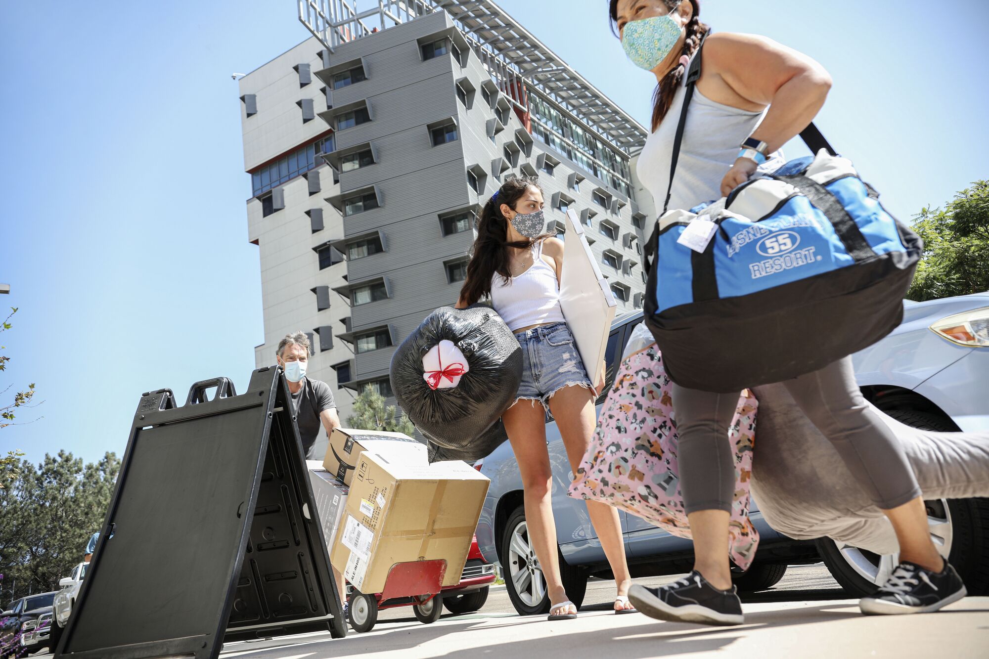 Holly Fleurbaaig moves her belongings into the dormitories at UC San Diego