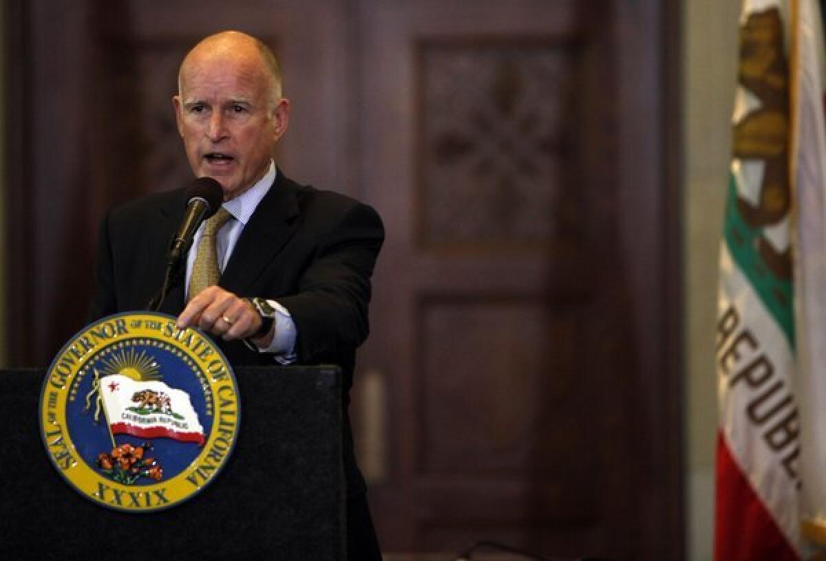 Gov. Jerry Brown, shown in 2012, on Thursday signed a bill that will allow people living in the country illegally to receive a permit to drive legally in California.