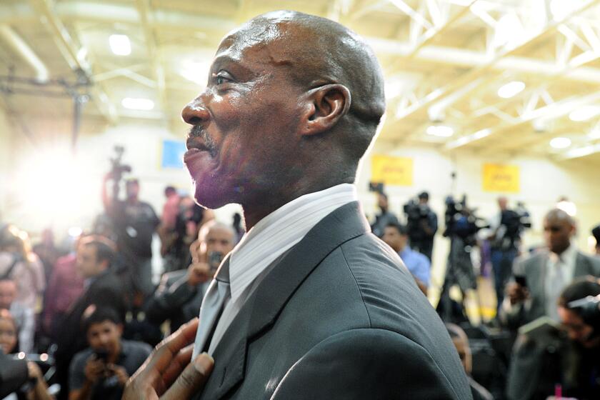 Byron Scott is introduced as the coach of the Lakers during a news conference at the team's training facility in El Segundo on July 24.