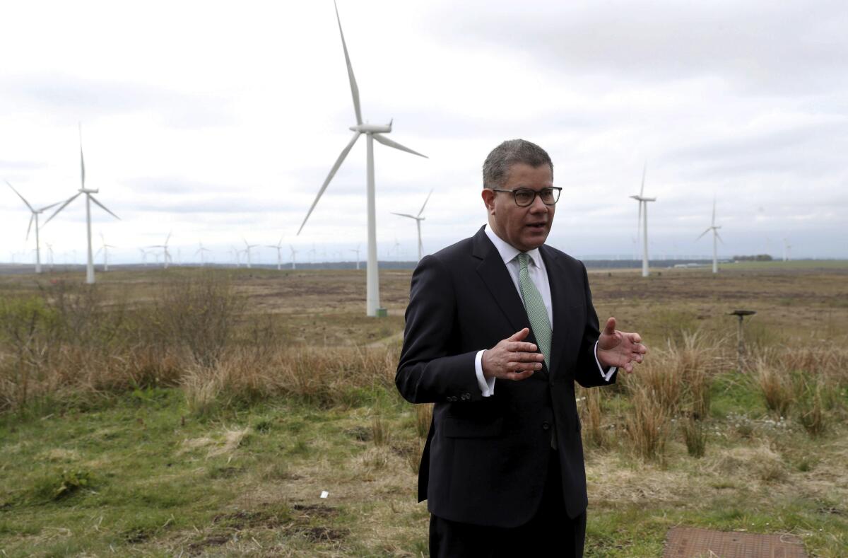 President of the 2021 United Nations Climate Change Conference, COP26, Alok Sharma prepares for a speech at Whitelee Windfarm in Glasgow, Scotland, Friday May 14, 2021. Sharma is setting out the importance of COP26 and the UK's ambitions over the next six months, running up to hosting the Nov. 1-12 summit, bringing world leaders together to face climate change issues. (Russell Cheyne/PA via AP)