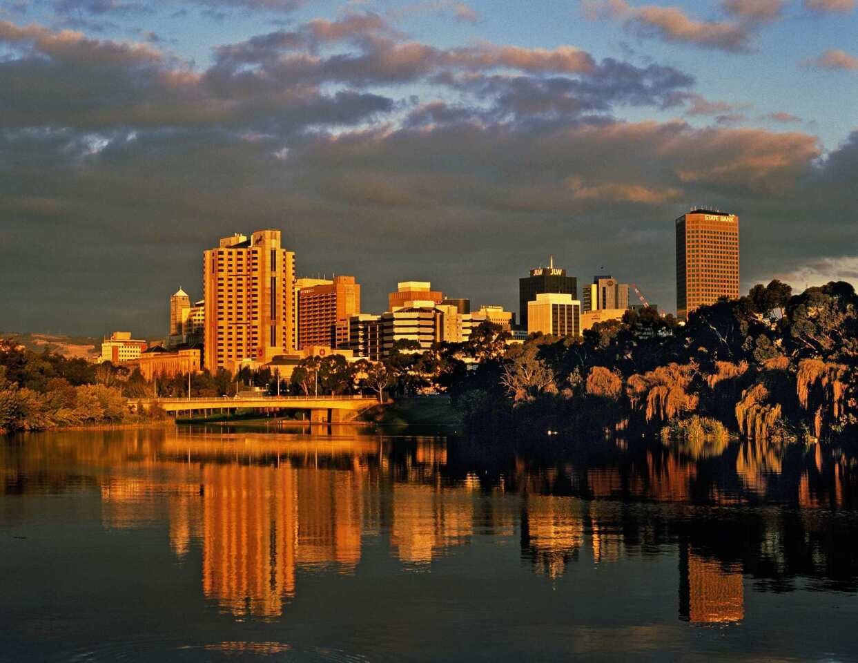 Adelaide, in South Australia, is reflected in Lake Torrens at dusk.