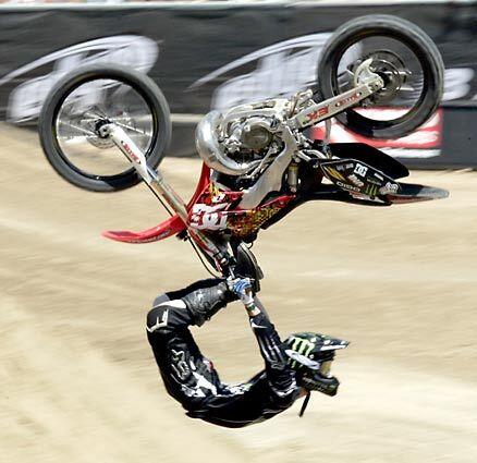 August 6, 2007: Adam Jones, who finished third, wows the crowd with an upside down Cordova in the Moto X Freestyle final during the X Games at the Home Depot Center in Carson.