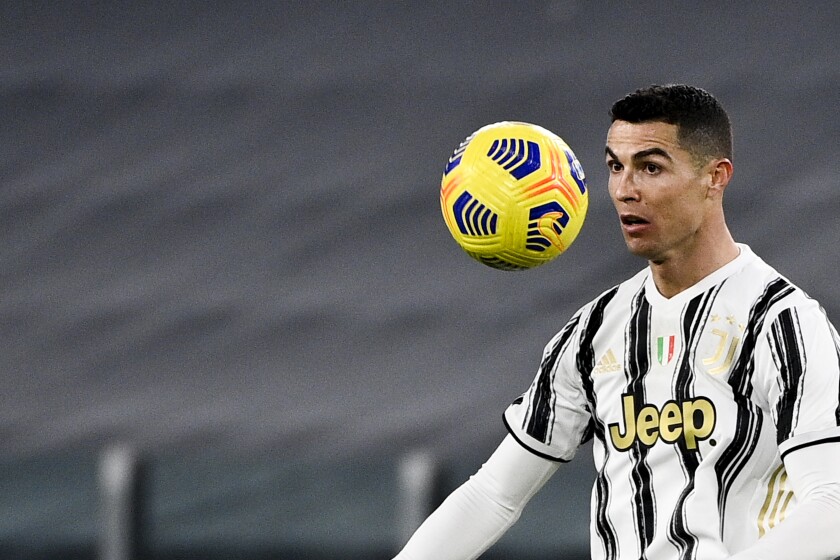 Juventus' Cristiano Ronaldo controls the ball during the Italian Cup, return-leg, semifinal soccer match between Juventus and Inter Milan, at the Turin Allianz Stadium, Italy, Tuesday, Feb. 9, 2021. (Marco Alpozzi/LaPresse via AP)