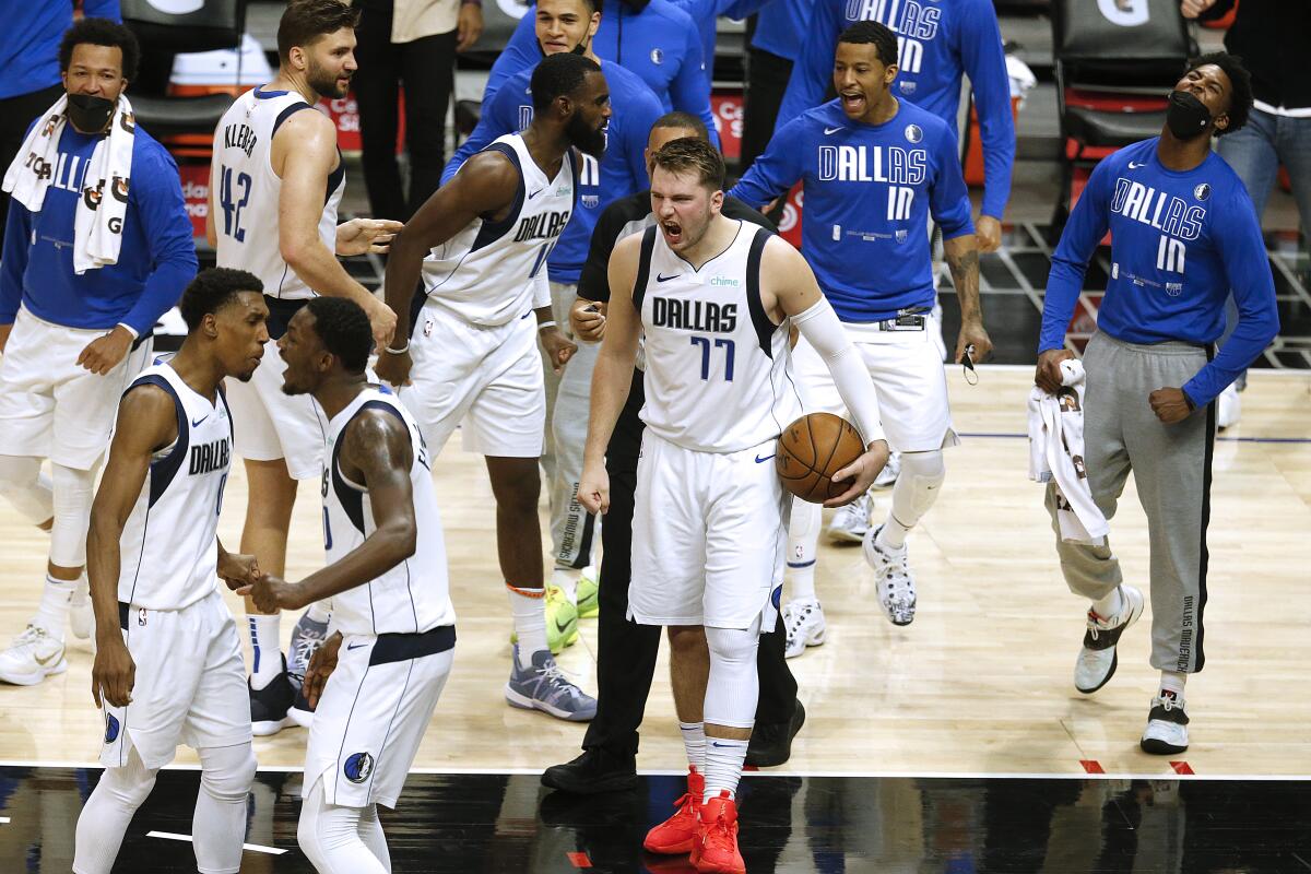 Dallas Mavericks guard Luka Doncic celebrates after beating the Clippers.