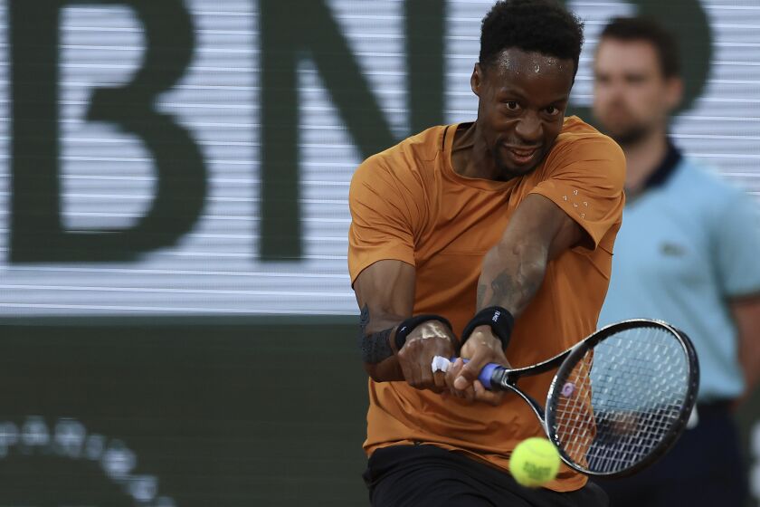 France's Gael Monfils plays a shot against Argentina's Sebastian Baez during their first round match of the French Open tennis tournament at the Roland Garros stadium in Paris, Tuesday, May 30, 2023. (AP Photo/Aurelien Morissard)