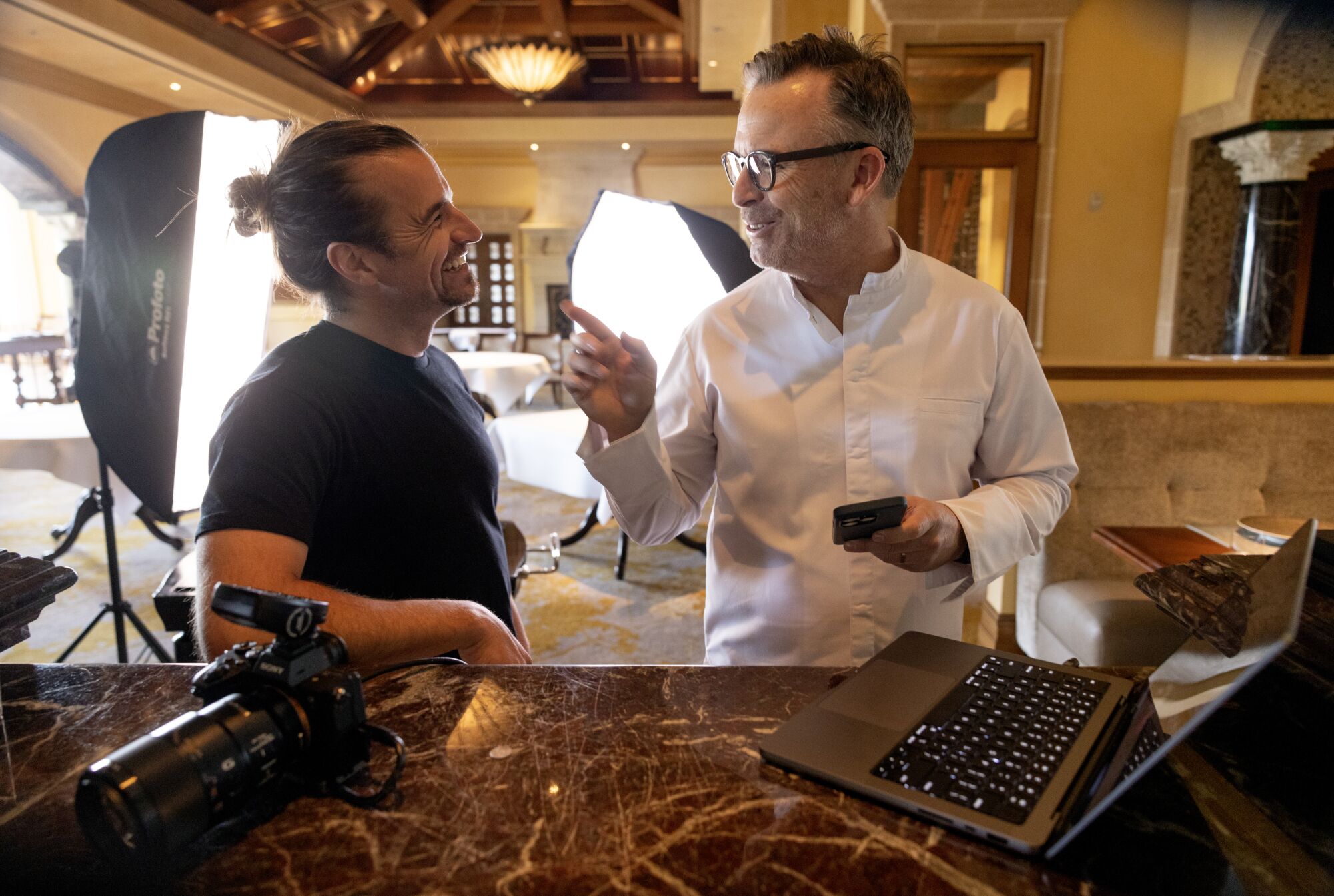 Food photographer Eric Wolfinger takes a pictures of Chef-Director William Bradley at Addison Restaurant.
