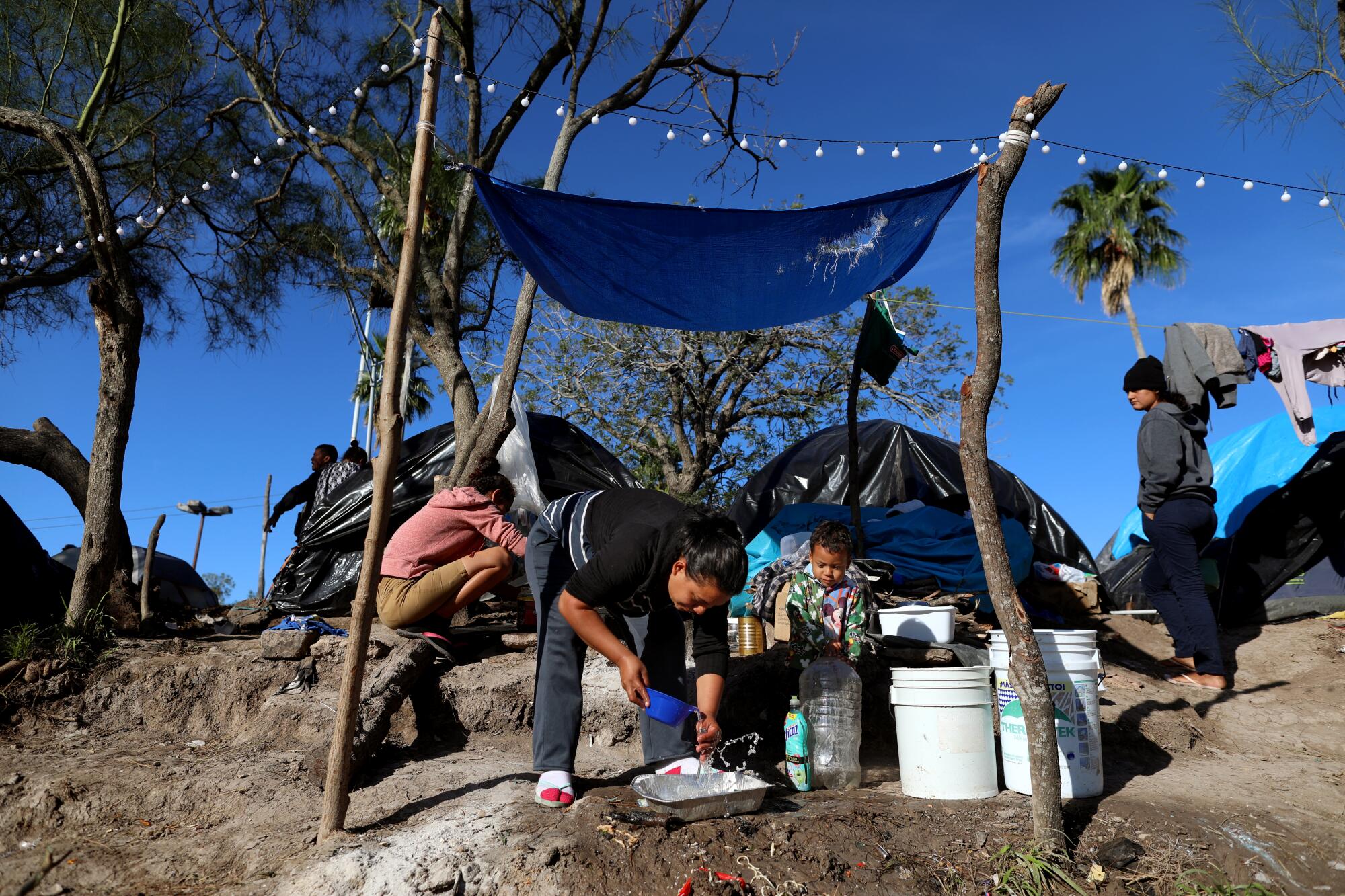 People in a makeshift camp.