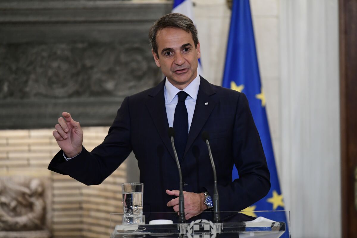Greece Prime Minister Kyrikos Mitsotakis speaks during a press conference after a meeting with his Dutch counterpart Mark Rutte, at Maximos Mansion in Athens, Greece, Tuesday, Nov. 9, 2021. (AP Photo/Michael Varaklas)