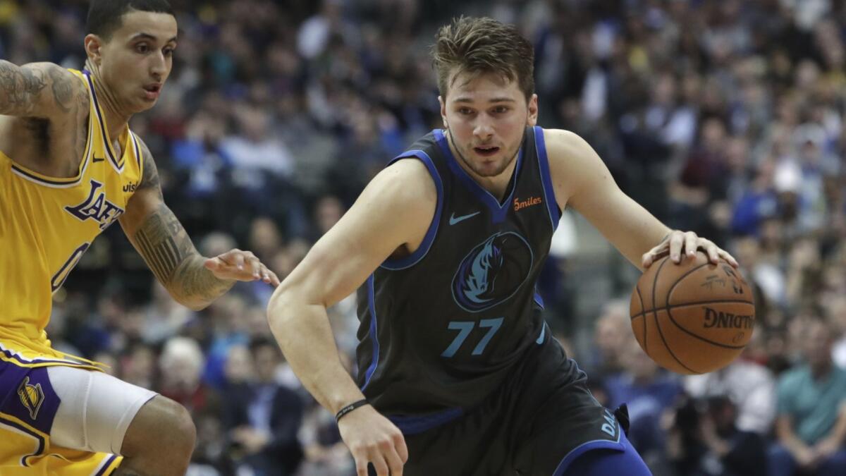 Mavericks forward Luka Doncic, driving past Lakers forward Kyle Kuzma, is the complete package on offense.