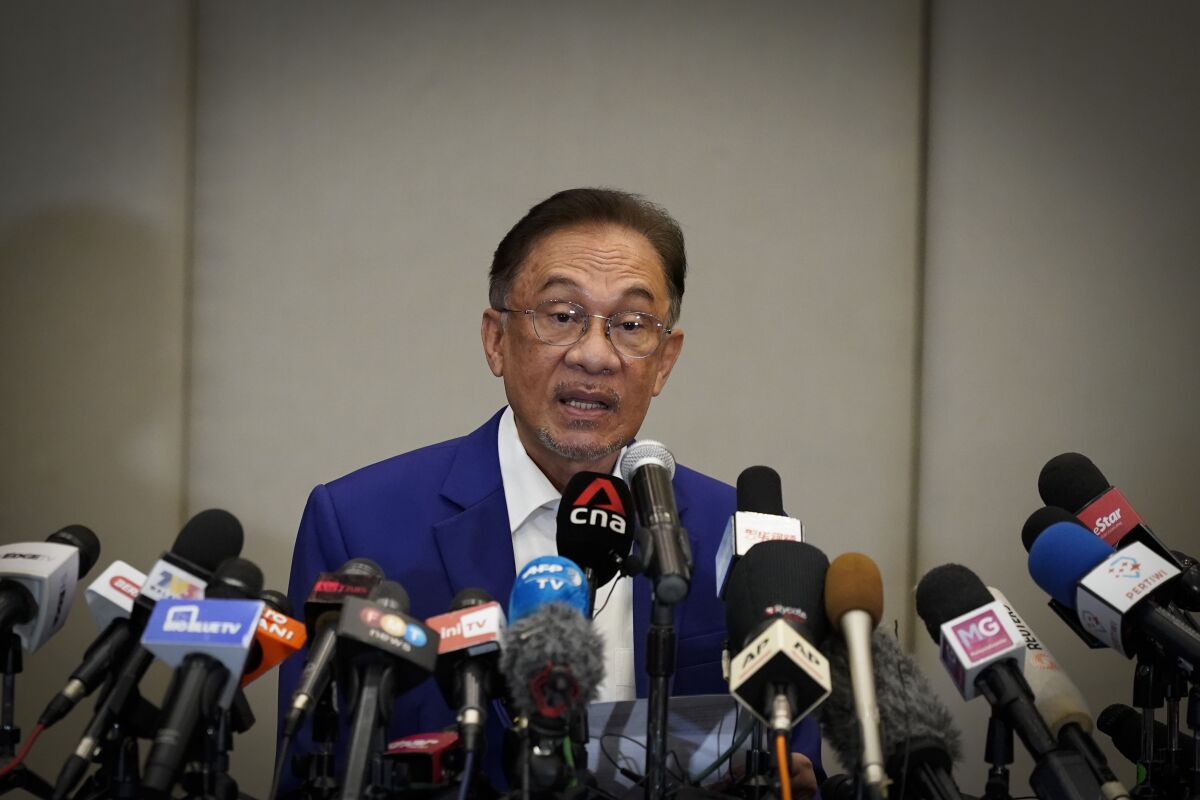 Malaysian opposition leader Anwar Ibrahim speaks during a press conference after meeting the nation's king in Kuala Lumpur, Malaysia, Tuesday, Oct. 13, 2020. Anwar met the king Tuesday in a bid to form a new government after claiming he had secured a majority in Parliament. (AP Photo/Vincent Thian)