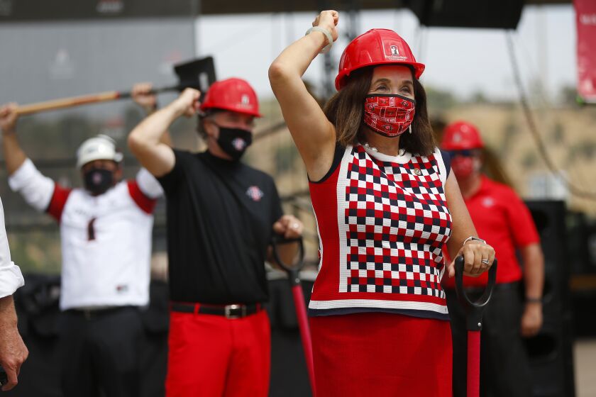 SAN DIEGO, CA - AUGUST 17: San Diego State University President Adela de la Torre, right, and athletic director J.D. Wicker celebrate during a groundbreaking for the SDSU Mission Valley project on Monday, Aug. 17, 2020 in San Diego, CA. (K.C. Alfred / The San Diego Union-Tribune)