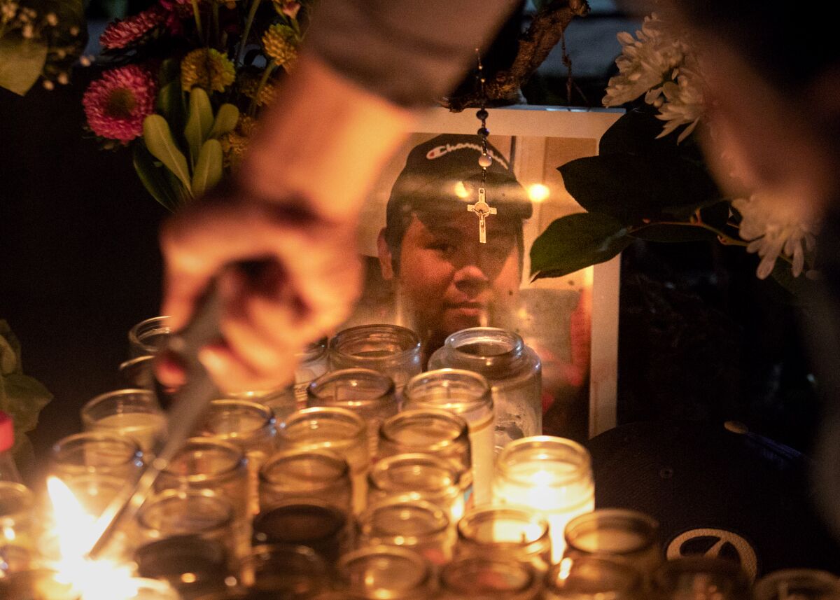 A picture of Xavier Chavarin, who was killed by David Zapata, sits among candles lit for his memorial 