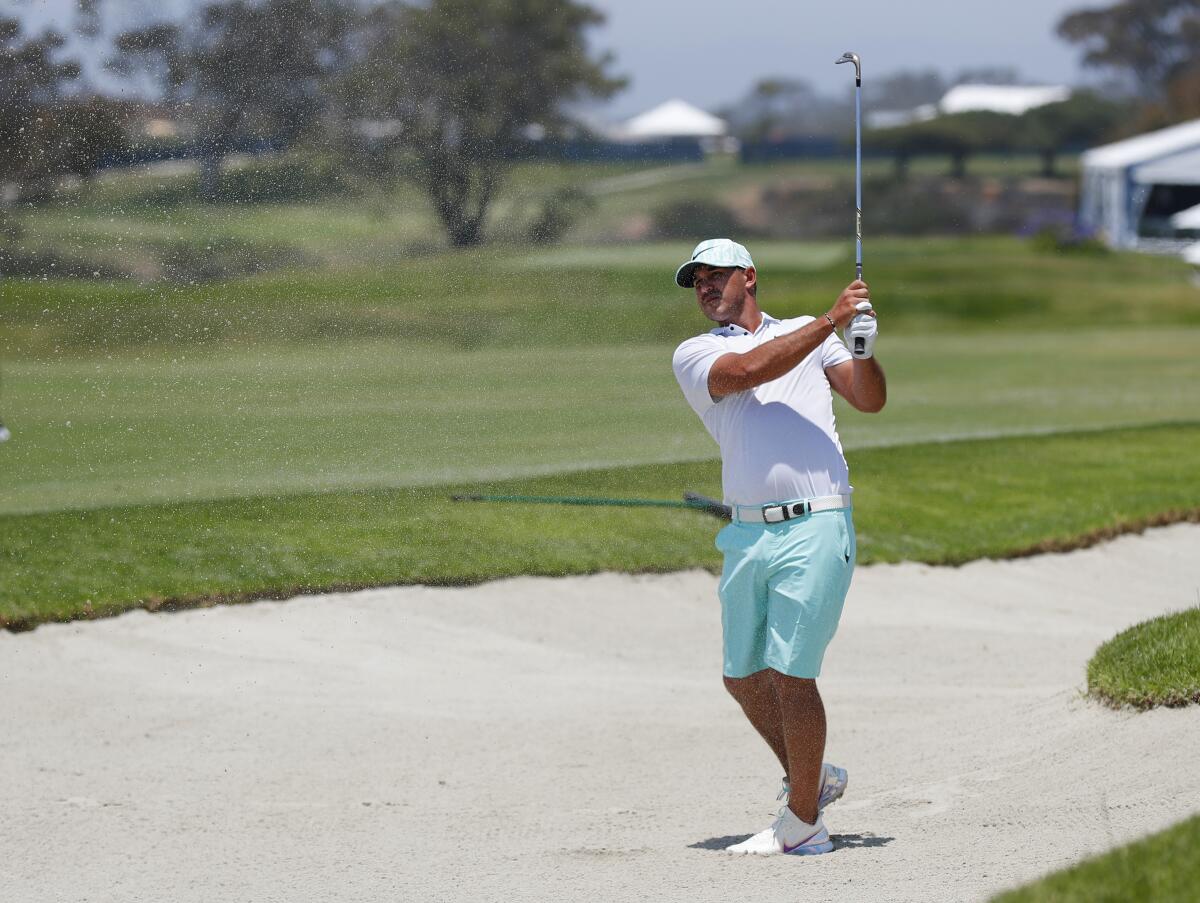 Brooks Koepka hits out of a bunker on the second hole at Torrey Pines during a practice round on Tuesday.
