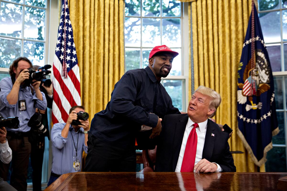Rapper Kanye West meets then-President Trump in the Oval Office of the White House on Oct. 11, 2018. 