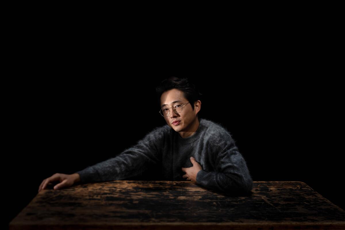  Steven Yeun is photographed in  the driveway, of a Pasadena, CA, home, on Wednesday, Nov. 11, 2020.