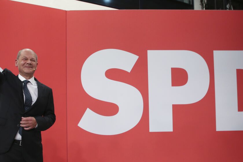 Olaf Scholz, Finance Minister and SPD candidate for Chancellor, waves during the election party at Willy Brandt House