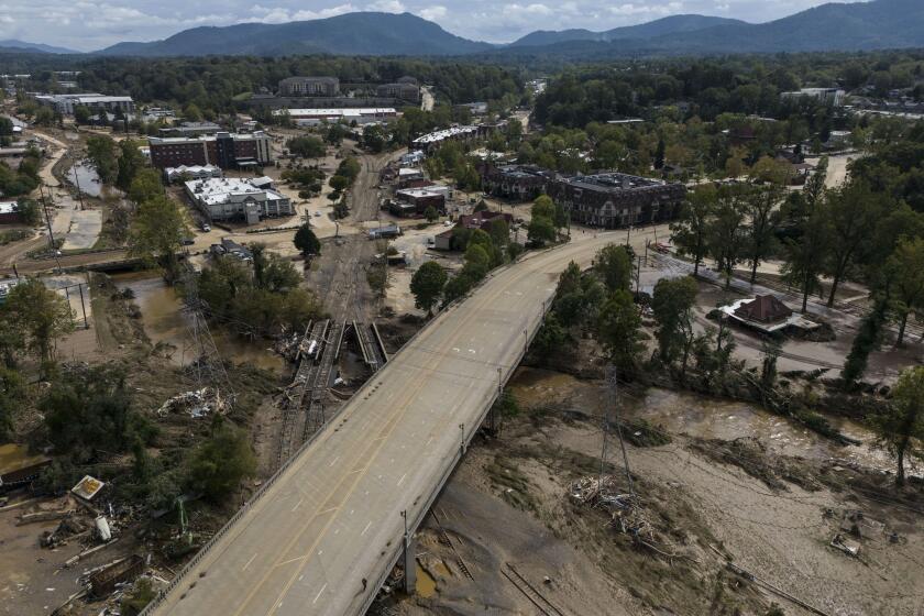 Debris is seen in the aftermath of Hurricane Helene, Monday, Sept. 30, 2024, in Asheville, N.C. (AP Photo/Mike Stewart)