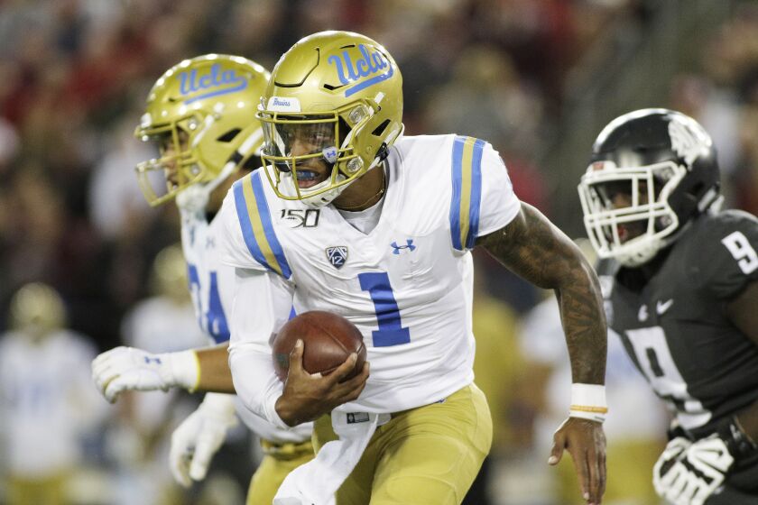 UCLA quarterback Dorian Thompson-Robinson (1) runs with the ball during the second half of an NCAA college football game against Washington State in Pullman, Wash., Saturday, Sept. 21, 2019. (AP Photo/Young Kwak)