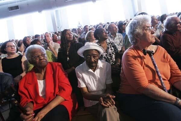A crowd listens at a town hall meeting in Shaker Heights, Ohio