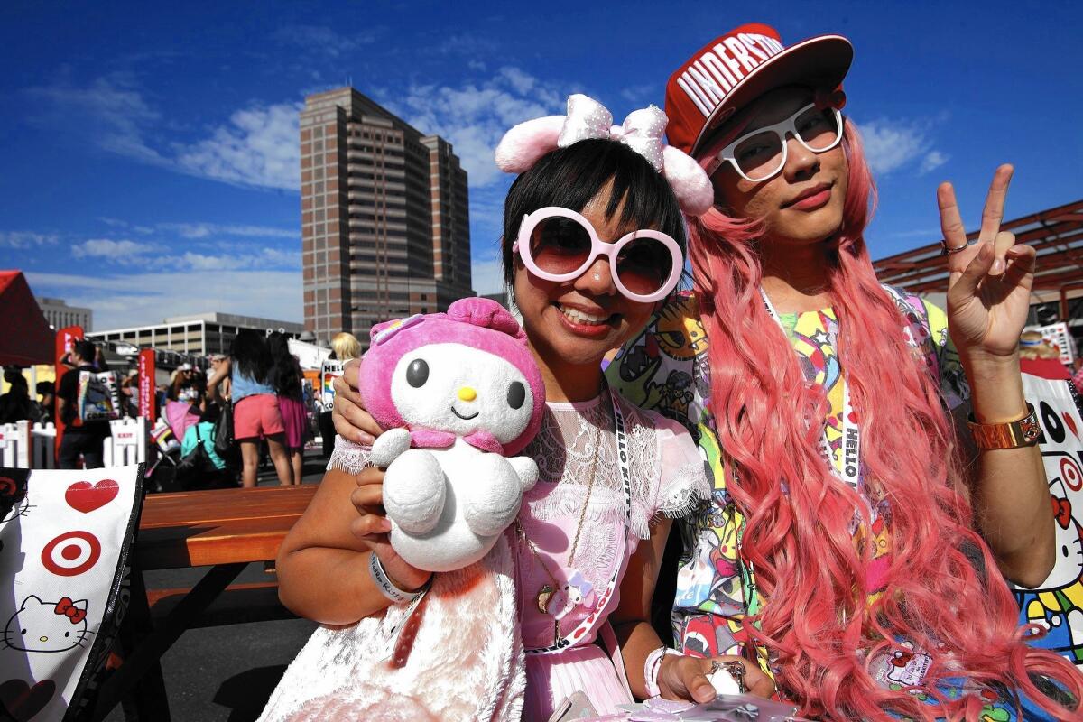 Jennifer Masaoay, 26, left, and Jaycee Castillo, 26, wear their best Hello Kitty outfits at the Hello Kitty Con 2014 at The Geffen Contemporary at MOCA in Los Angeles on Oct. 30, 2014.