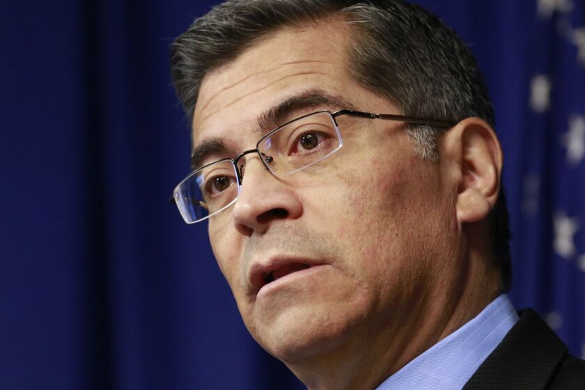 File - In this Feb. 20, 2018, file photo, California Attorney General Xavier Becerra discusses the need for bail reform, in Sacramento, Calif. Judges must consider suspects' ability to pay when they set bail amounts, Becerra said Tuesday, May 1, 2018, adding momentum to ongoing talks aimed at finding a better way to make sure suspects show up in court. Judges should only keep suspects in jail awaiting trial if they are dangerous or are likely to flee, Becerra said. (AP Photo/Rich Pedroncelli, File)