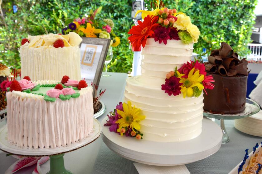 Sweet Lady Jane presents an array of whole cakes including, almond crunch, lemon raspberry, old fashioned chocolate, and a custom wedding cake with fresh flowers.