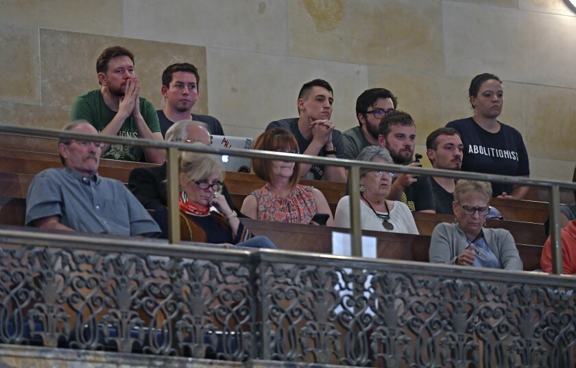 People keep a close watch from the gallery as HB813 concerning abortion is heard on the floor during legislative session, Thursday, May 12, 2022, in the House Chambers of the Louisiana State Capitol in Baton Rouge, La. (Hillary Scheinuk/The Advocate via AP)