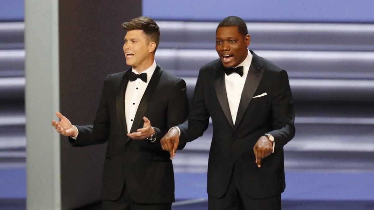 Hosts Colin Jost and Michael Che during the show at the 70th Primetime Emmy Awards at the Microsoft Theater.