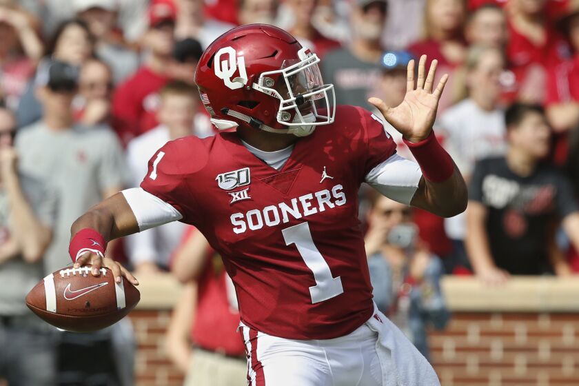 Oklahoma quarterback Jalen Hurts (1) throws in the first quarter of an NCAA college football game against Texas Tech in Norman, Okla., Saturday, Sept. 28, 2019. (AP Photo/Sue Ogrocki)
