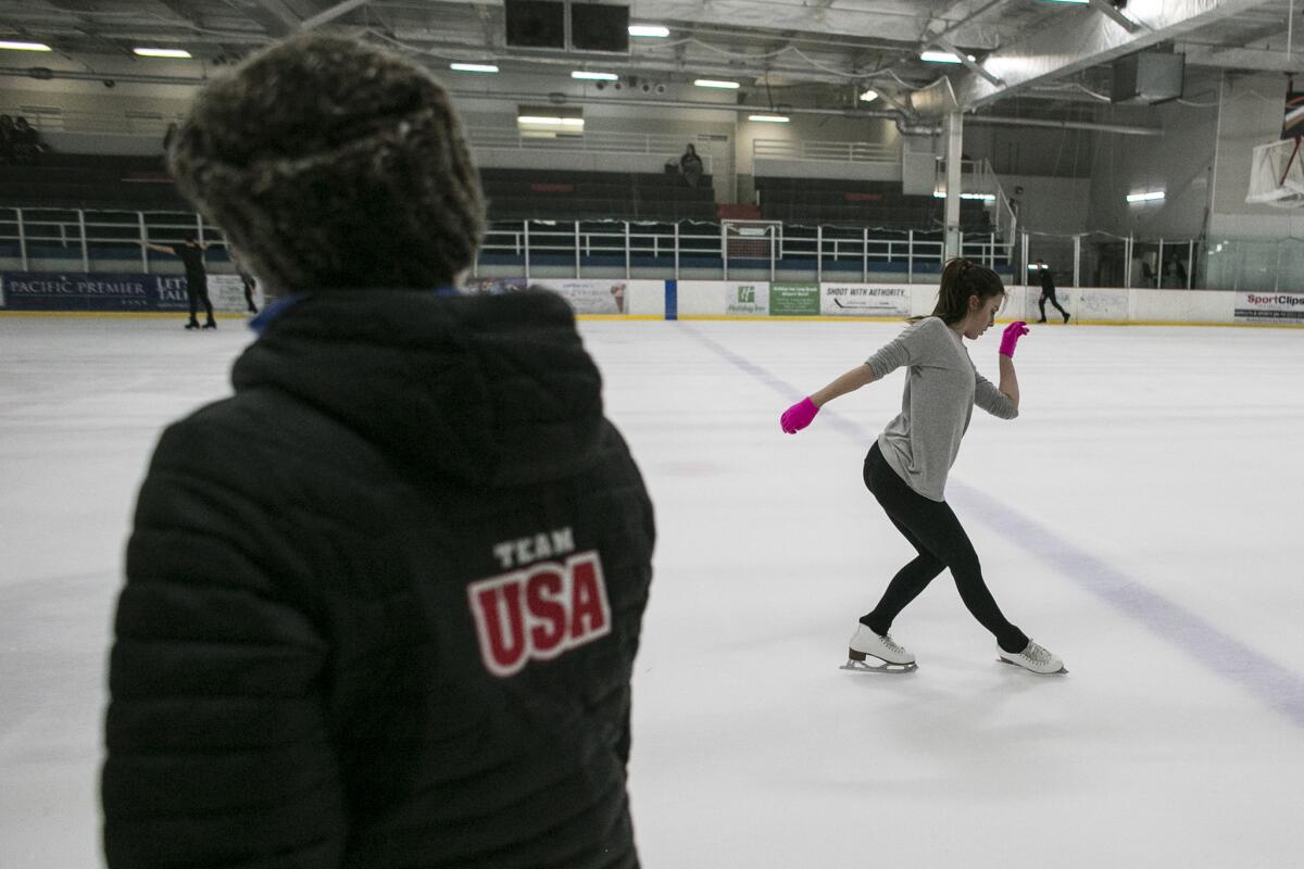 U.S. Olympic figure skater Ashley Wagner consults with Nadia Kanaeva during a practice session at The Rinks-Lakewood in 2016.