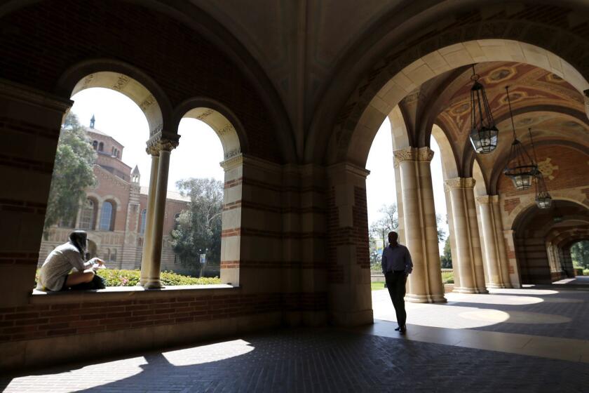 WESTWOOD, CA -- WEDNESDAY, APRIL 13, 2016: A student studies in the archway of Royce Hall at UCLA in Westwood, CA, on April 13, 2016. (Allen J. Schaben / Los Angeles Times)