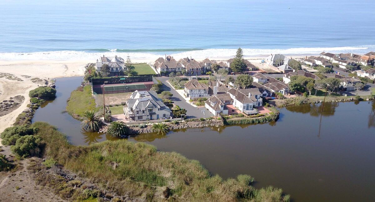 Saint Malo homeowners have agreed to a proposals to remove the wier at the mouth of the Buena Vista Lagoon in south Oceanside.