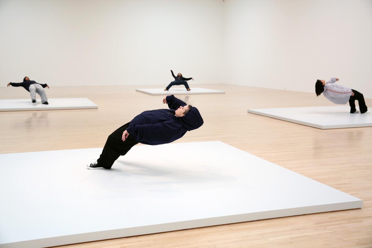 Live sculptures in artist Xu Zhen's "In Just the Blink of an Eye" at MOCA.