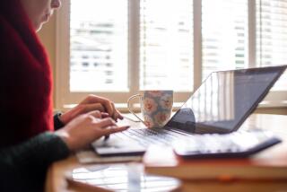 Coronavirus - Mon Mar 29, 2021. EMBARGOED TO 0001 MONDAY MARCH 29 File photo dated 04/03/20 of a woman using a laptop on a dining room table set up as a remote office to work from home. Home working is here to stay and the end of the five-day-a-week office commute will change the shape of cities dramatically, according to former Bank of England deputy governor Sir Charlie Bean. Issue date: Monday March 29, 2021. Sir Charlie has become the latest prominent figure to declare that the traditional, office-based working week is over as he predicted firms will adopt a permanent flexible model after the pandemic. See PA story CITY Bean. Photo credit should read: Joe Giddens/PA Wire URN:58853548 (Press Association via AP Images)