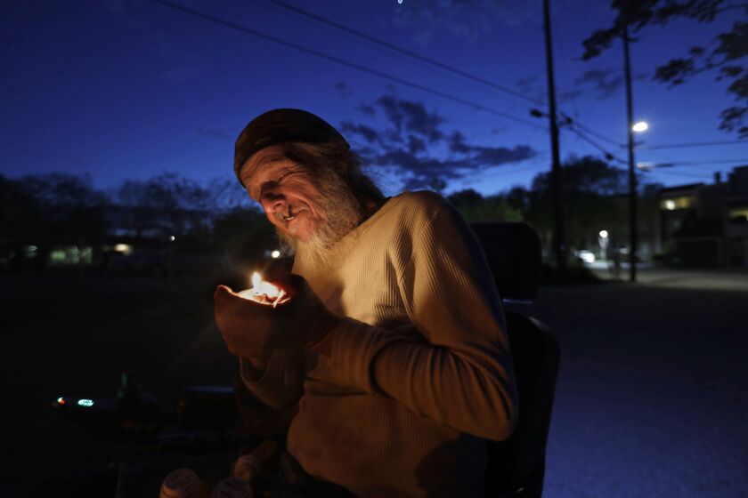 RED BLUFF, CA - APRIL 16: Brian Phillips, age 60, has been self-medicating with pot since he was a boy when he got in a car accident and his mother gave him some to ease his pain. He moved from Los Angele to Red Bluff, California in 1972, where he rides around town in an electric wheelchair after suffering a second accident later in life. There are no medical marijuana dispensaries within miles, but Phillips has no problem finding pot. "There ain't no dispensaries in this town," said Phillips, "This is one poor town." He worries that there are sick people in his apartment building, but so far there has only been one case of Covid-19 in Red Bluff, CA. (Carolyn Cole / Los Angeles Times)
