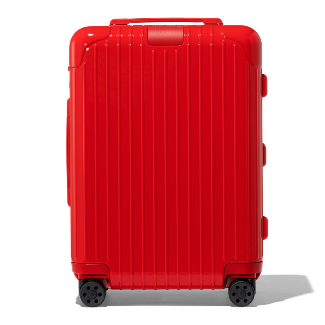 A red rolling suitcase