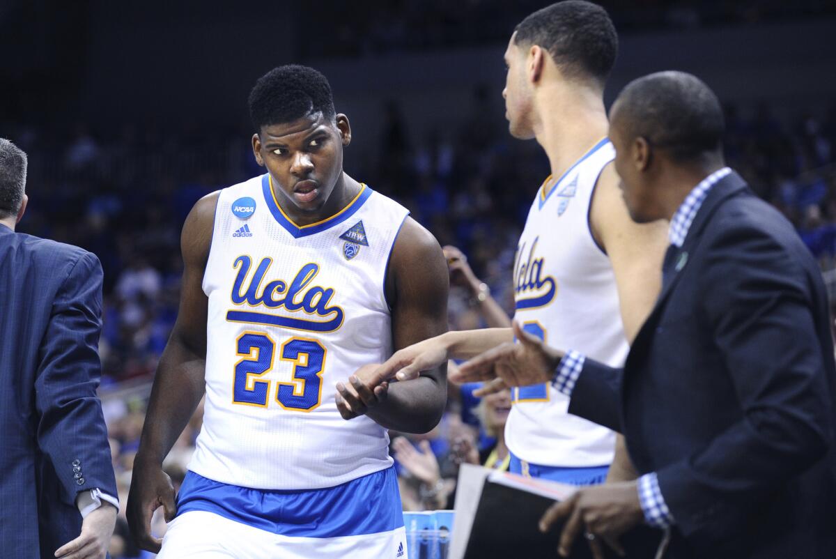 UCLA forward Tony Parker is congratulated as he comes off the court late in an NCAA tournament game in March.