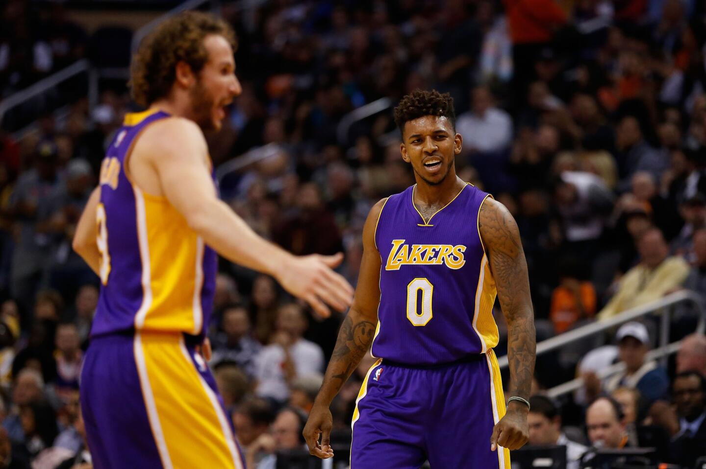 Lakers guard Nick Young reacts after teammate Marcelo Huertas scores against the Suns.
