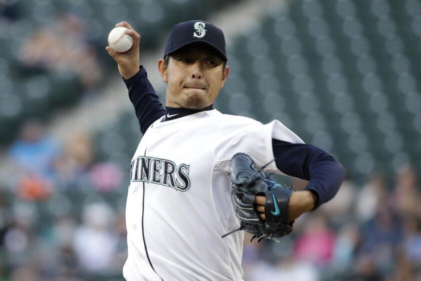 Seattle Mariners starting pitcher Hisashi Iwakuma pitches against the Houston Astros on Monday. Iwakuma was placed on the 15-day disabled list on Friday because of a right lat strain.