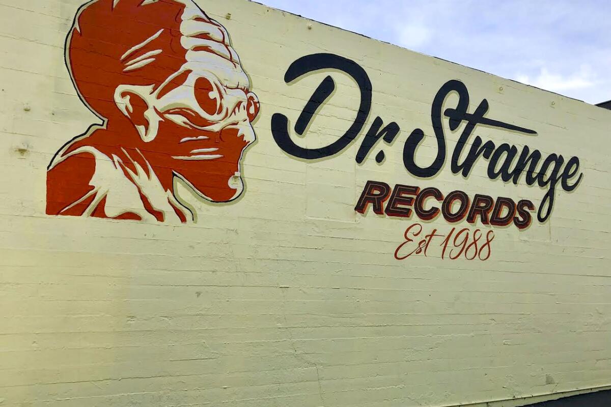 A sign painted on a wall for Dr. Strange Records.